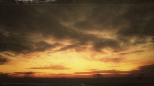 Scenic view of dramatic sky during sunset