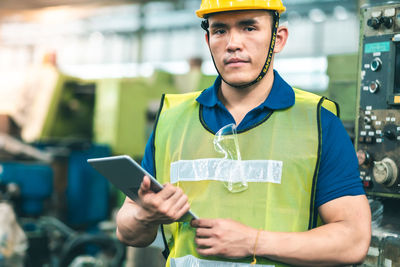 Portrait of young man using mobile phone