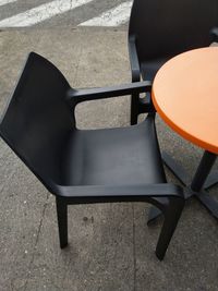 High angle view of empty chair on table