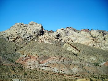 Scenic view of rocky mountains against clear blue sky