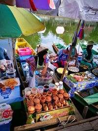 People for sale at market stall