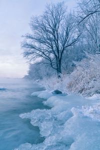 Scenic view of sea against sky during winter