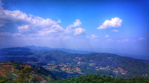 High angle view of landscape against blue sky