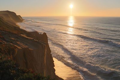 Scenic view of sea against sky during sunset