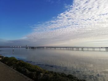 Bridge over sea against sky