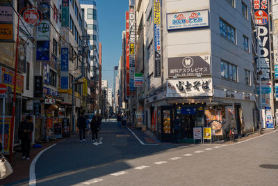 People walking on street in city