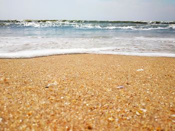 Surface level of beach against sky