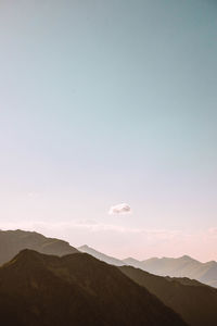 Scenic view of mountains against clear sky during sunset