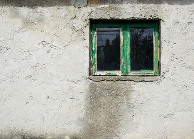 Low angle view of window on wall of building