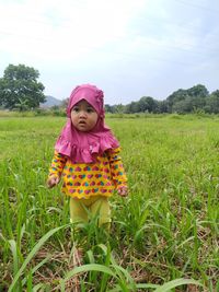 Full length of baby girl standing on land