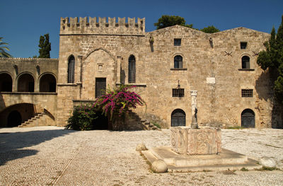 Old palacein rhodos against clear sky