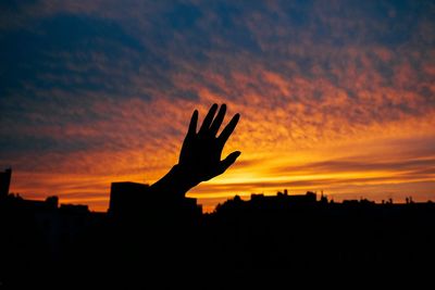 Silhouette of man against sunset