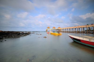 Boats in sea against sky