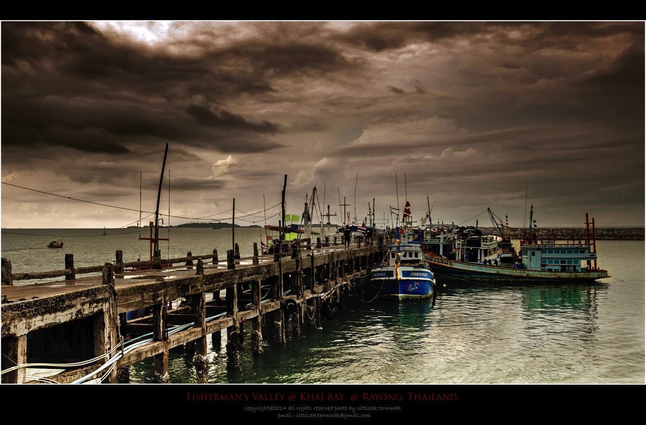 water, sky, sea, nautical vessel, cloud - sky, cloudy, transportation, boat, moored, mode of transport, cloud, harbor, horizon over water, nature, overcast, weather, tranquility, pier, tranquil scene, scenics