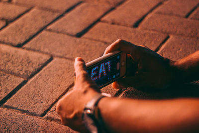 Close-up of hand holding smart phone