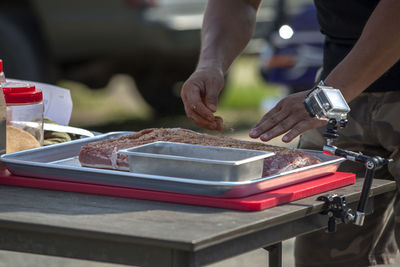 Mid section of a man preparing food