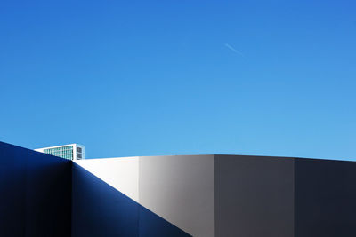 Low angle view of building against clear blue sky