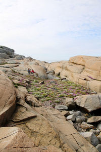 Rock formations on landscape against sky