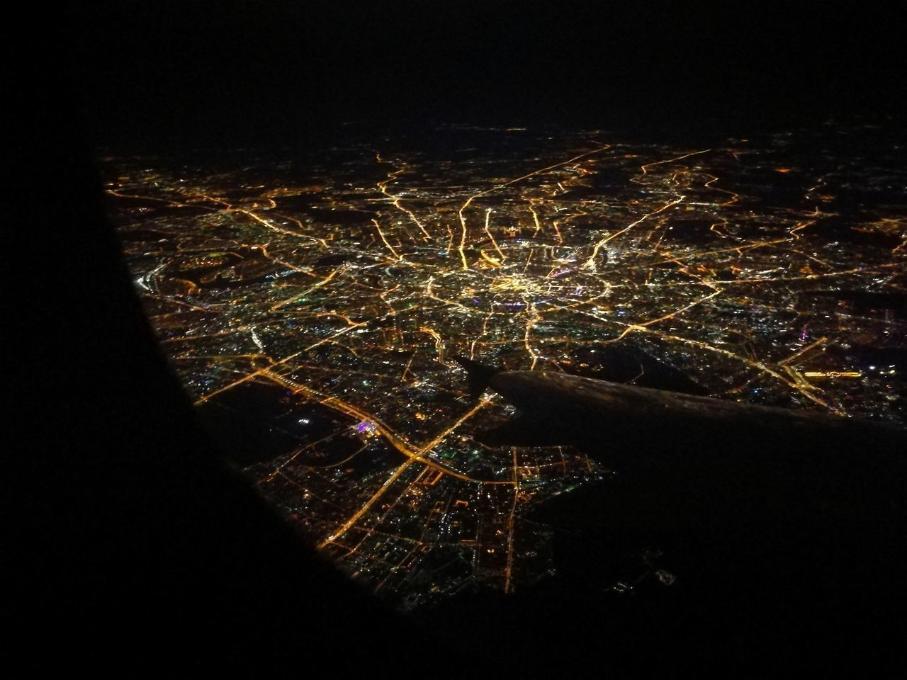 HIGH ANGLE VIEW OF ILLUMINATED BUILDINGS IN CITY