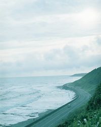 Scenic view of sea against cloudy sky