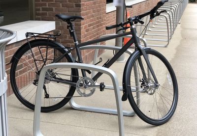 Bicycle parked against building