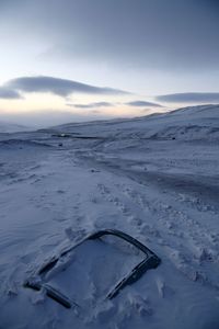 Scenic view of snow covered mountains