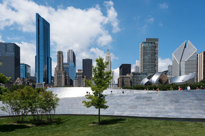 Modern buildings in city against sky