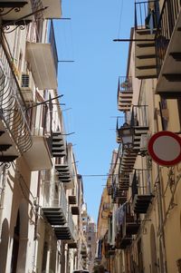 Low angle view of buildings against clear sky