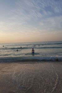 Scenic view of beach against sky during sunset