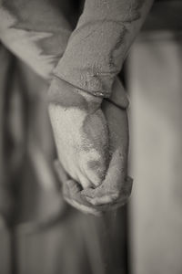 Close-up of hand holding statue