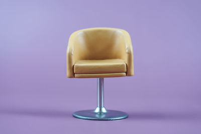 Close-up of empty chair against white background