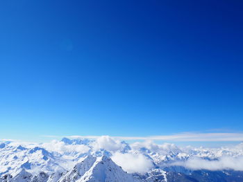 Scenic view of mountains against cloudy sky