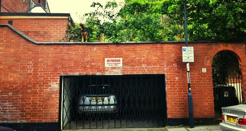 View of brick wall with closed door