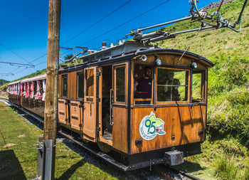 Train on railroad track against sky