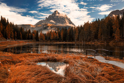 Scenic view of lake and mountains against sky