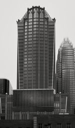 Low angle view of buildings in city against sky