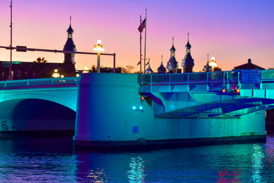 Lightblue illuminated bridge in west kennedy boulevard and top view of henry b. plant museum 