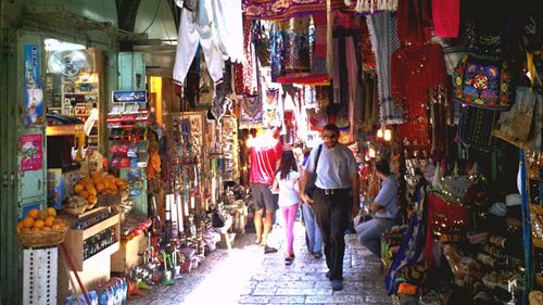 Group of people at market stall