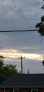 Low angle view of building against sky at sunset