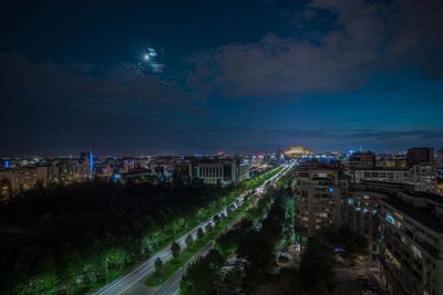 High angle view of illuminated city buildings at night