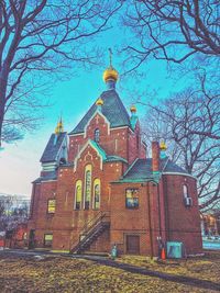 Low angle view of church against blue sky