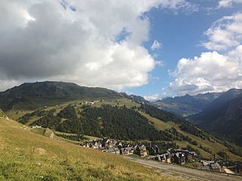 Scenic view of mountains against cloudy sky