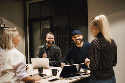 Coworkers having meeting in office