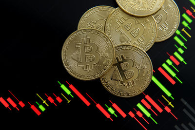 Close-up of illuminated lighting equipment against black background