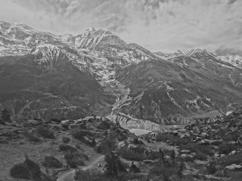 Scenic view of snowcapped mountains against sky