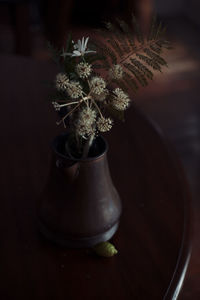 Close-up of flower vase on table