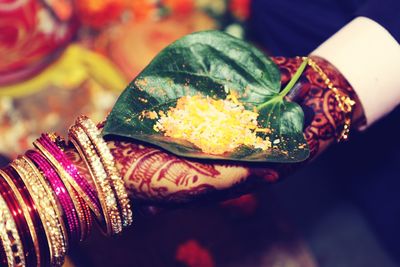 Close-up of bride and groom hands