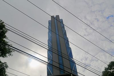Low angle view of skyscraper against sky