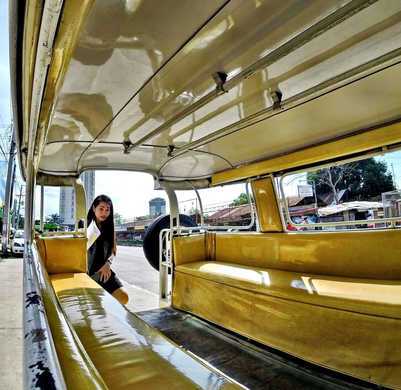 REAR VIEW OF MAN STANDING IN SUBWAY TRAIN