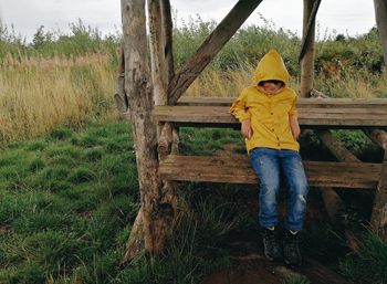 Portrait of boy standing on field